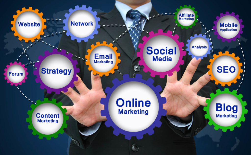 We see a businessman's hands firmly grasping gears with the words social media and online marketing.