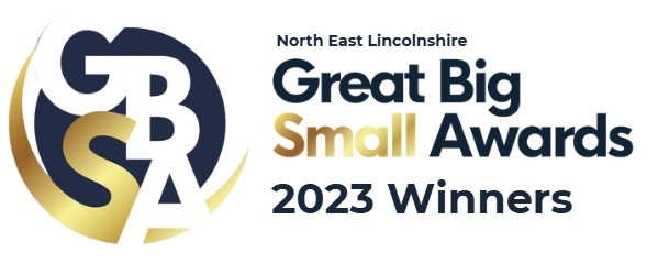 Logo for the “Great Big Small Awards 2023 Winners" from North East Lincolnshire, featuring stylized gold and navy letters "GBSB.